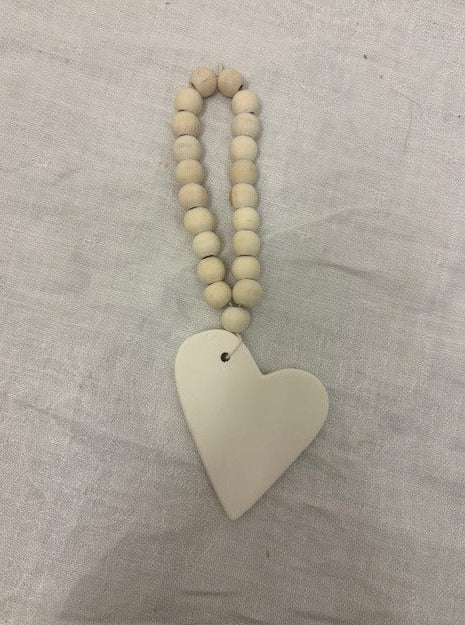 strand - natural wood bead w/ white ceramic heart